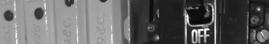 A row of old fuse switches, one marked OFF